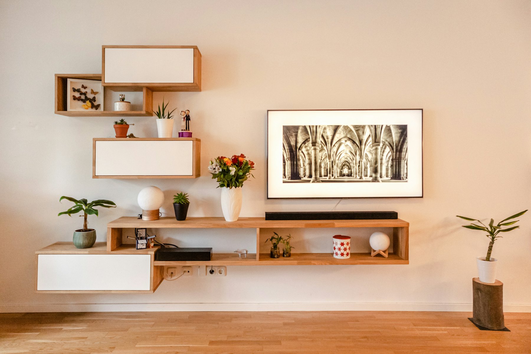 Shelving styled with framed artwork and objects