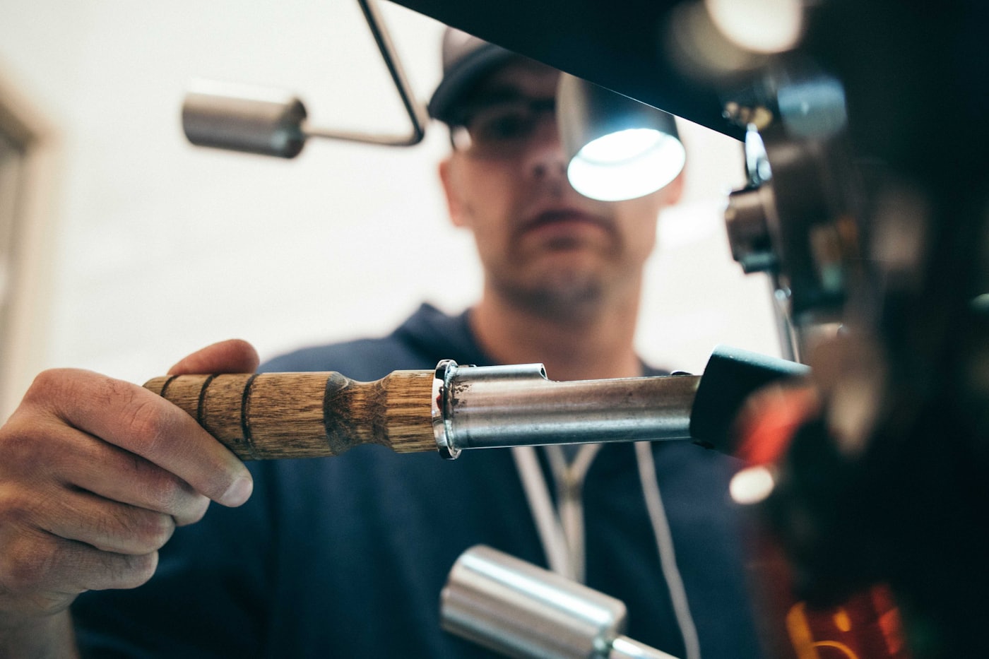A photographer adjusting studio lighting