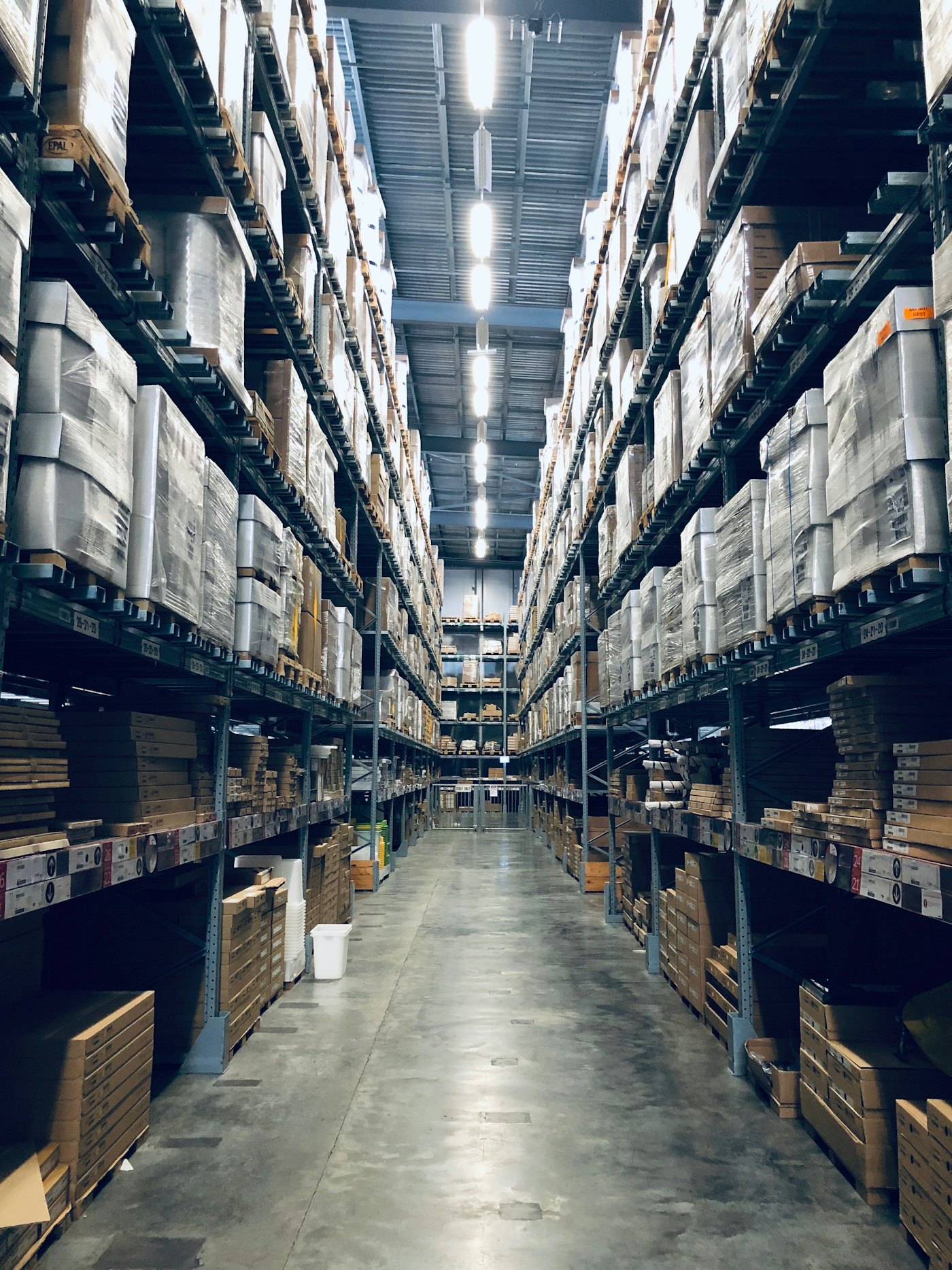 A warehouse racking aisle stretching into the distance